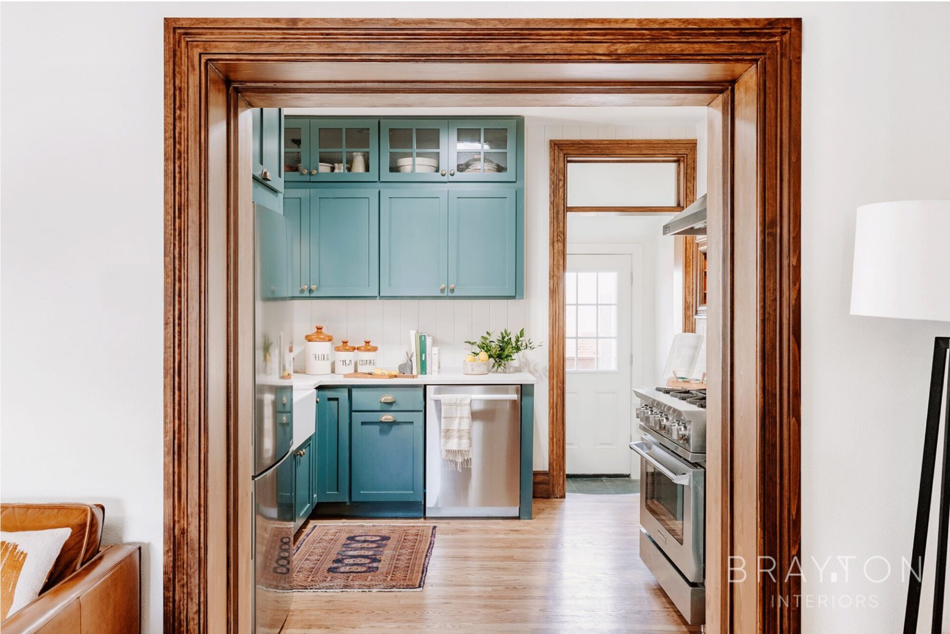 To create a more open concept in a historic home, a larger entryway was created with custom millwork to keep with the original architecture and design of this home.