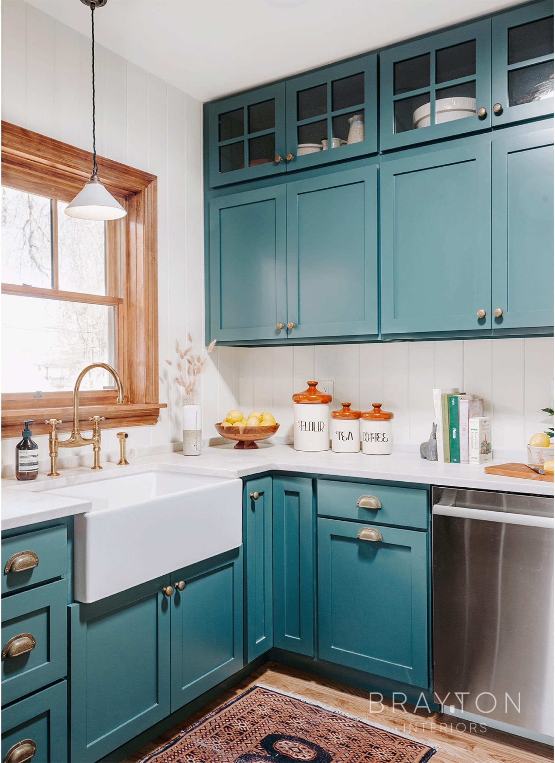 This historic Highlands townhome renovation features custom colored cabinetry, handmade brass hardware and plumbing fixtures, handmade ceramic pendant light and a custom wood framed window.