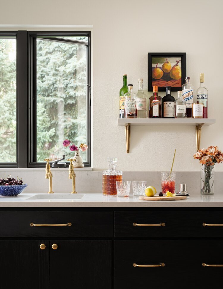 New wet bar with an upper shelf made from countertop remnants.
